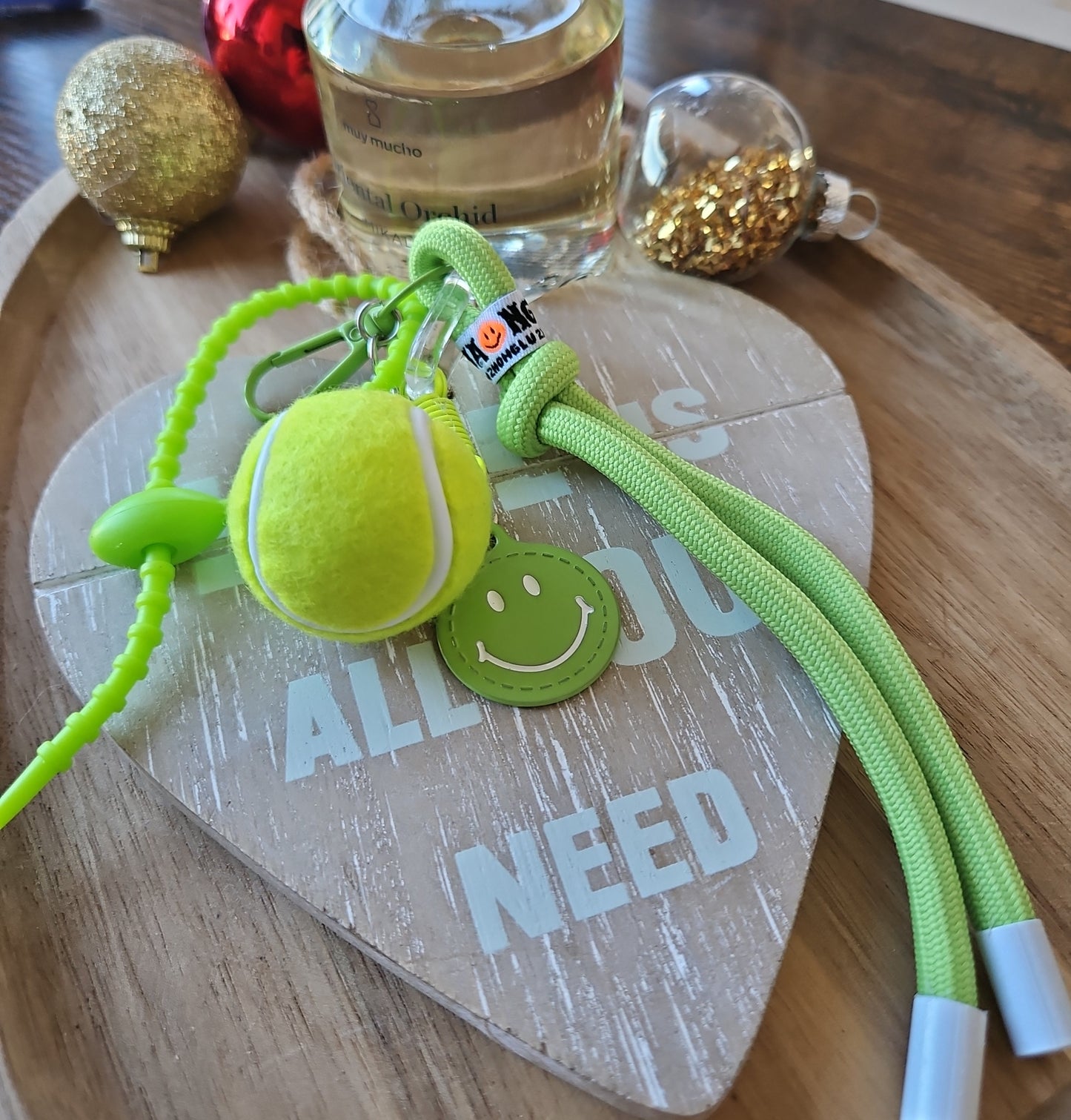 Grigris sac vert balle de tennis