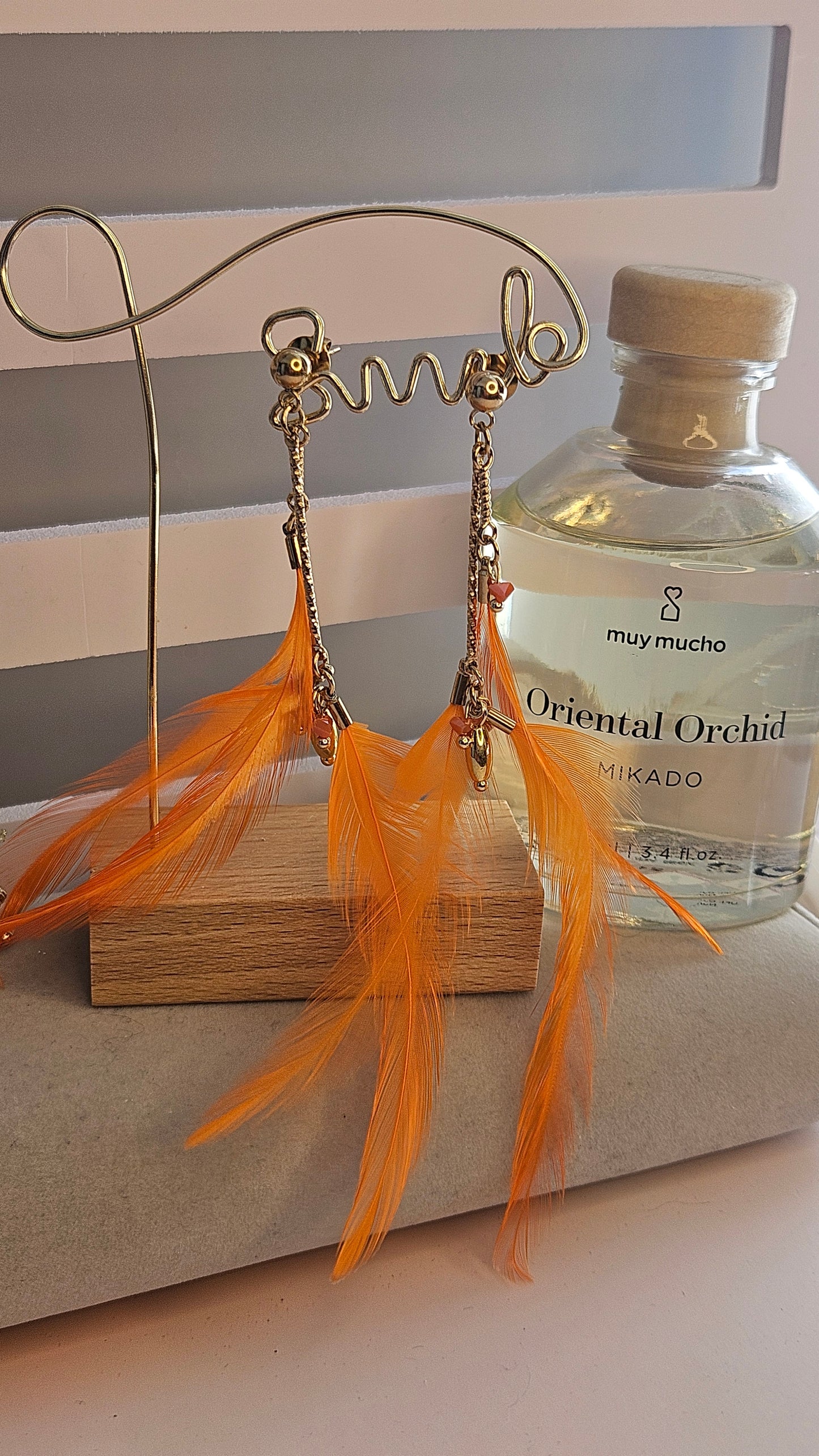 Boucle d'oreille plume orange