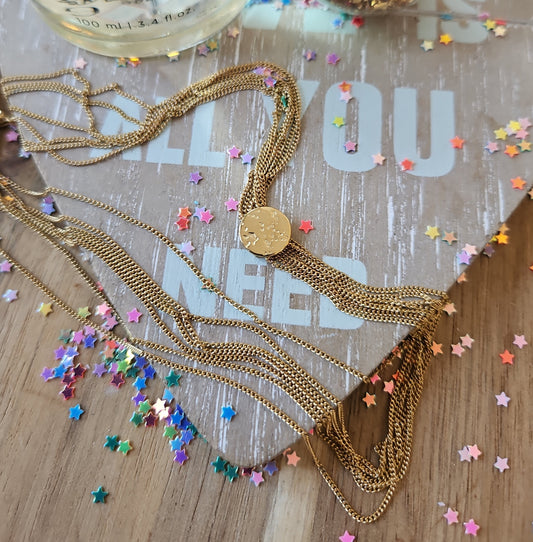 Multi-chain necklace with small medal